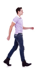 side view of a fashion man walking forward
