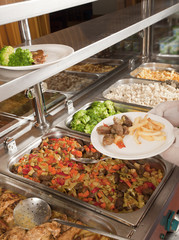 chef standing behind full lunch service station