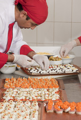 chef garnishing canapes