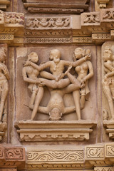 Fototapeta na wymiar Erotic carvings at Khajuraho Temple, Madhya Pradesh, India