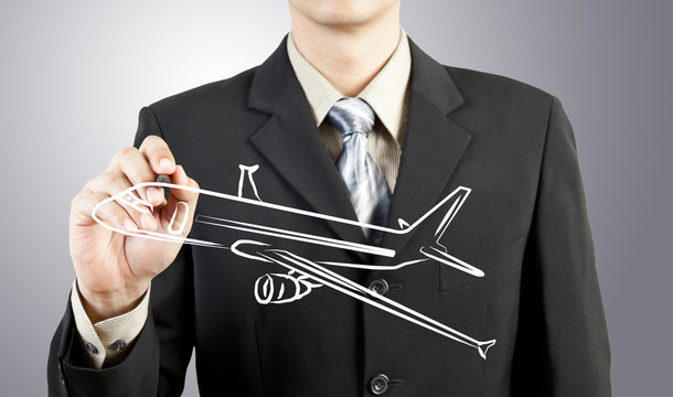 Business man draw plane  transportation