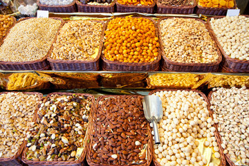 Dried nuts at market display in a row