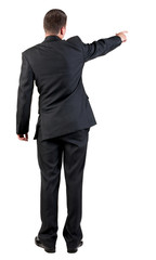 Back view of pointing business man.