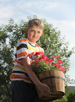12  years old boy with potted flower