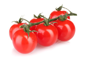 Beautiful cherry tomatoes on a branch isolated on white
