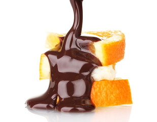 sliced ​​ripe orange with chocolate isolated on white