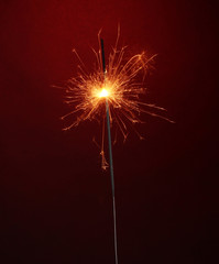 beautiful sparkler on red background