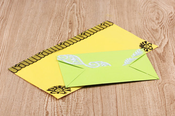 Color envelopes on wooden background