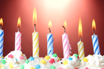 beautiful birthday candles  on red background
