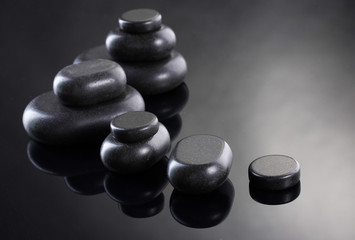 Spa stones on grey background