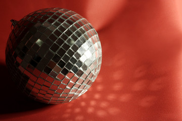 disco ball on red background