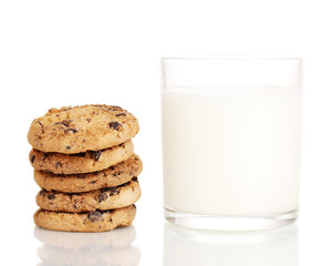 Glass of milk and cookies isolated on white