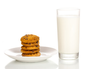 Glass of milk and cookies isolated on white