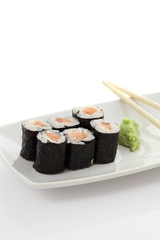Salmon Maki sushi with chopsticks