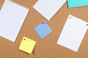 Fototapeta premium collection of note papers on corkboard