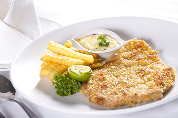 pork chop dish, white dish with pork chop steak a la carte