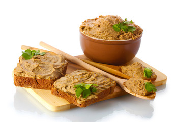 Fresh pate with bread on wooden board isolated on white