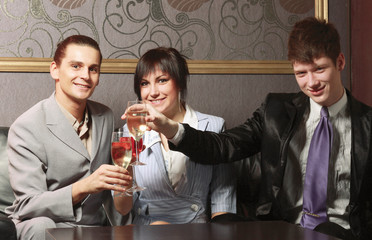 A businessteam celebrating in a restaurant