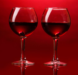 Wineglasses on red background