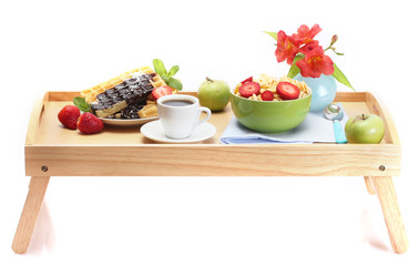 light breakfast on wooden tray isolated on white