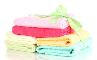 Obraz na płótnie Canvas Colorful towels with ribbon isolated on white
