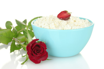 cottage cheese with strawberry in blue bowl and rose