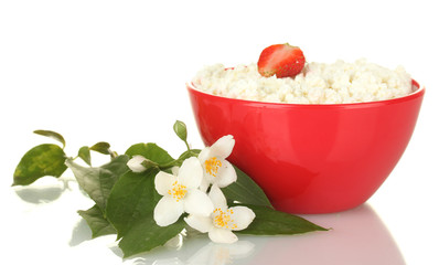 cottage cheese with strawberry in red bowl and flowers