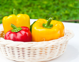 fresh sweet  paprika in wood basket