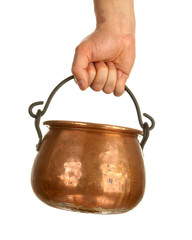 Hand holding bronze pot