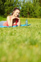 Beautiful happy smiling sport fitness model outside on summer /