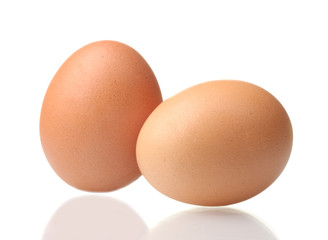 two brown eggs isolated on white