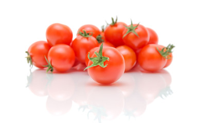 Tomatoes on a white background with reflection