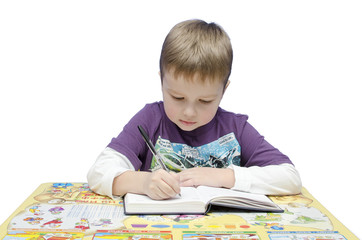 Portrait of a young schoolboy at his desk