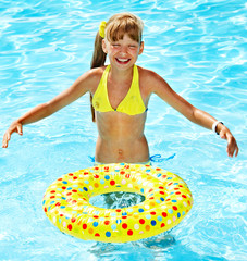 Little girl in swimming pool.