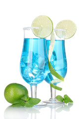 Blue cocktail in glasses with ice and sugar isolated on white