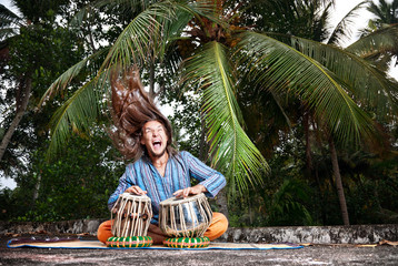 Tabla player with hair up