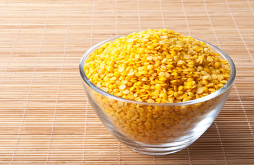 glass bowl full of yellow split lentils