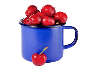 Cherries in a blue mug