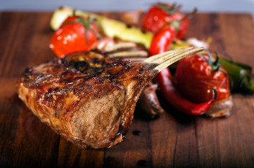 grilled mutton chops on cutting board - 41951105