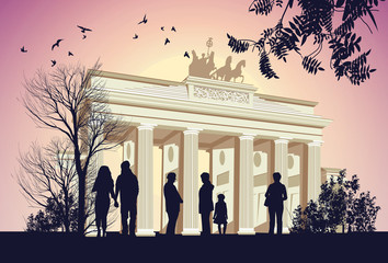 Group of people walking around the Brandenburger Gate © Stockerteam