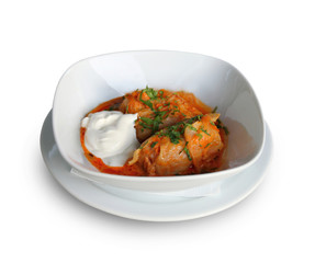 Stuffed cabbage with tomato sauce in white plate