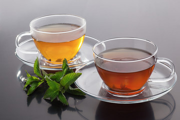 Transparent cup with green tea and  fresh mint leaves