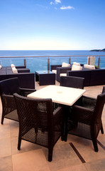 Rattan armchairs on the terrace