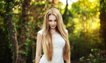 The beautiful blonde in a short white dress