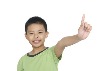a cute little boy pointing upward
