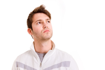 Obraz premium Thinking young man looking up on white background