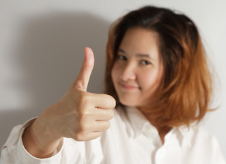 businesswoman holding thumps up