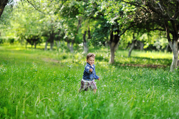 Adorable little boy having fun in a park