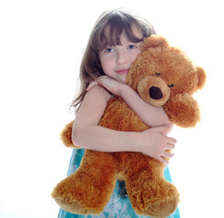 Little girl taking teddy bear