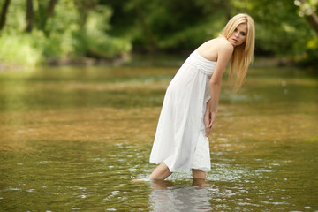 Summer beautiful women in  a river